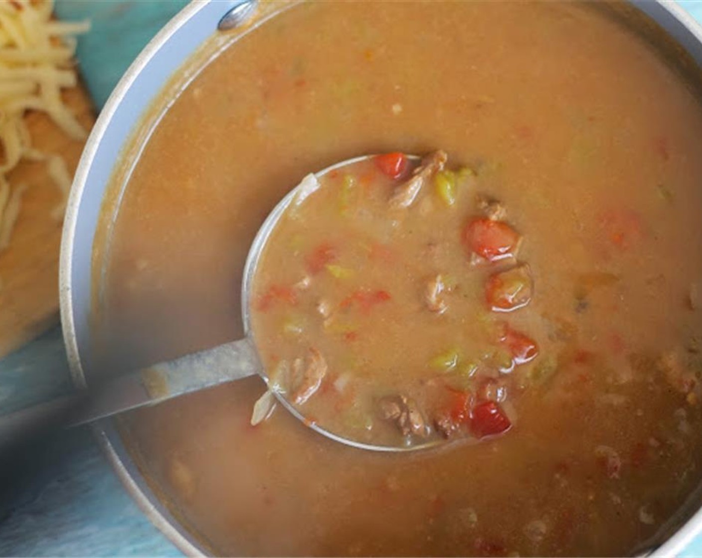 step 5 Pour into the large stock pot and add Green Chili Peppers (2 cups), Tomatoes (2 cups), Water (5 cups), Salt (to taste), and Ground Black Pepper (to taste).  Simmer approximately one hour.