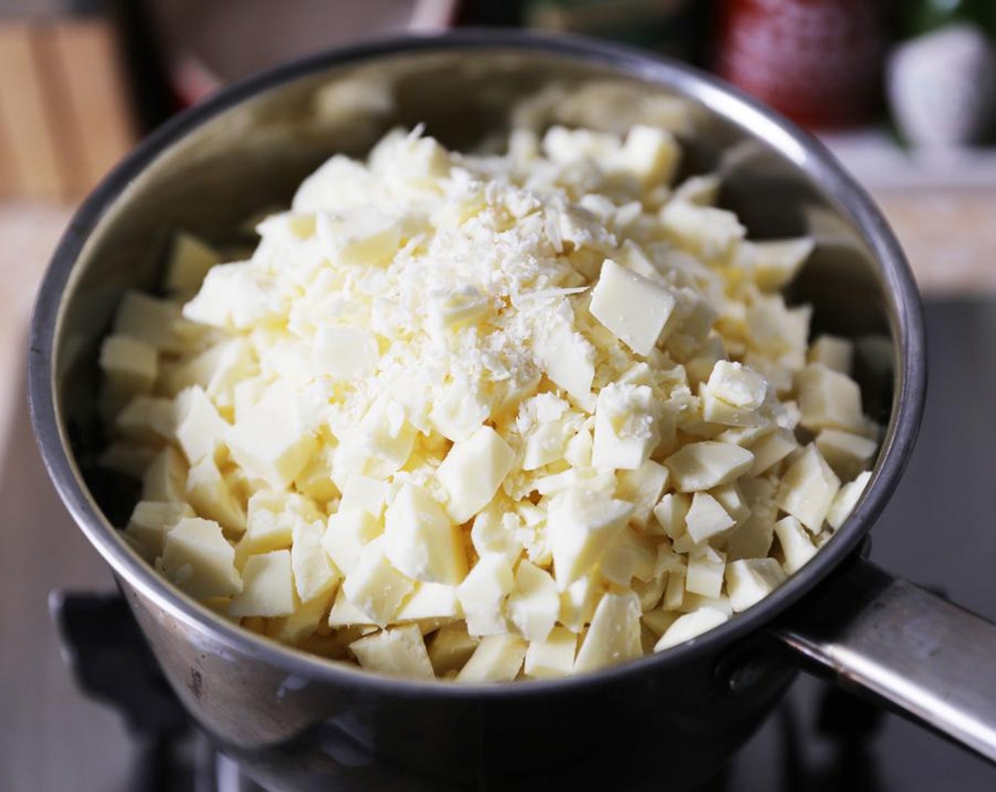 step 1 Place the Sweetened Condensed Milk (2 2/3 cups) and White Chocolate (5 1/3 cups) in a saucepan.