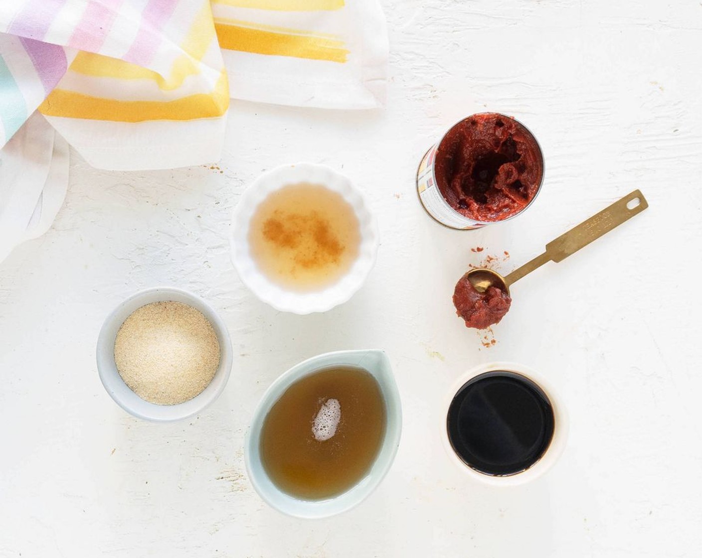 step 8 In a small mixing bowl, combine the Tomato Paste (1 can), Maple Syrup (1/4 cup), Tamari Soy Sauce (1/4 cup), Apple Cider Vinegar (2 Tbsp) and McCormick® Garlic Powder (1 tsp) with a whisk until fully combined.