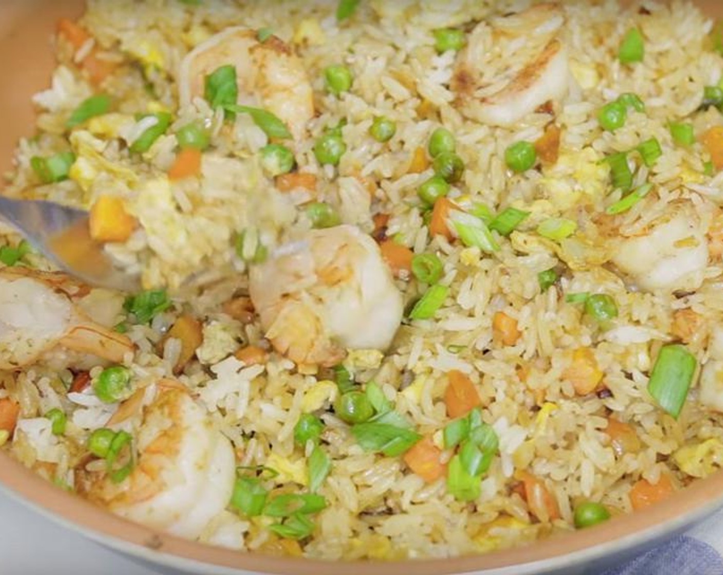step 4 Add the cooked White Rice (1 cup), shrimps, and Soy Sauce (3 Tbsp), and stir to combine. Cook until the rice and shrimps are reheated. Garnish with Scallions (to taste) and serve.