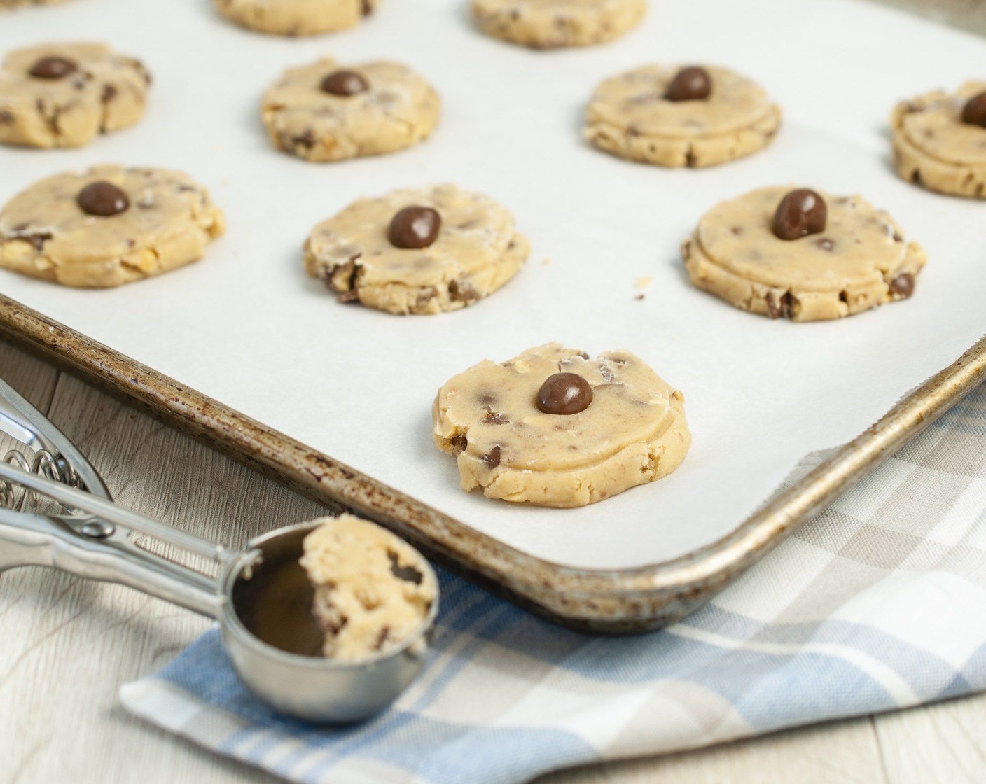 step 10 Top each cookie with one of the Chocolate Covered Peanuts (30).