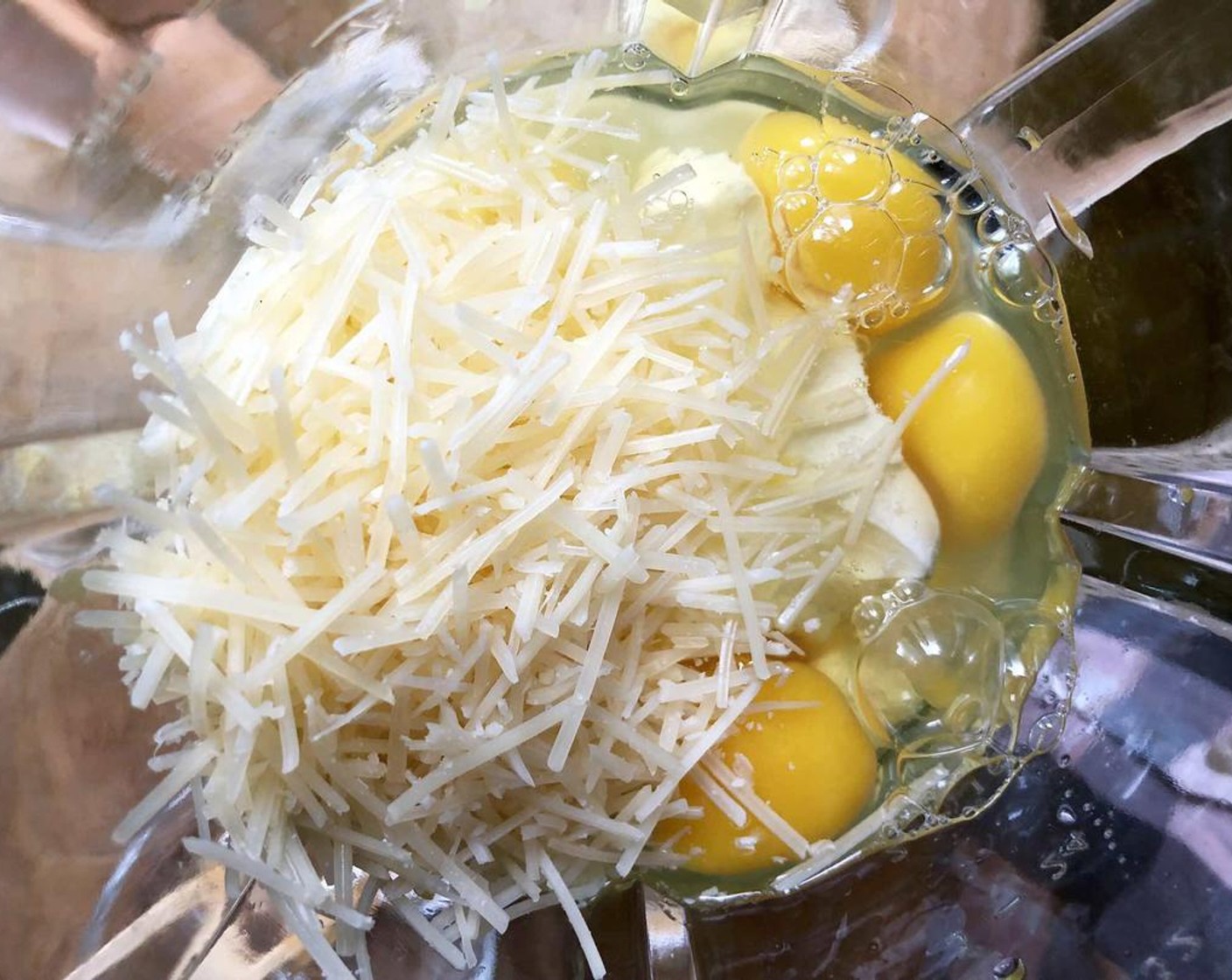 step 1 Place the softened Philadelphia Original Soft Cheese (3/4 cup), Farmhouse Eggs® Large Brown Eggs (6), Grated Parmesan Cheese (1/3 cup), and optional Granulated Erythritol (1 tsp) in the blender. Blend on low until the ingredients are completely combined.