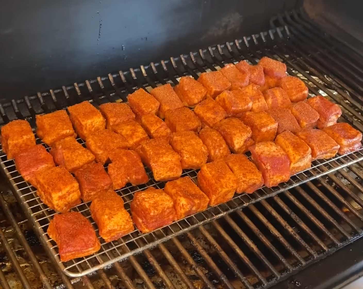 step 3 Spray a raised cooking rack with Vegetable Oil (as needed) and place pork belly pieces on the rack. Cook on the pellet grill for 2 hours.