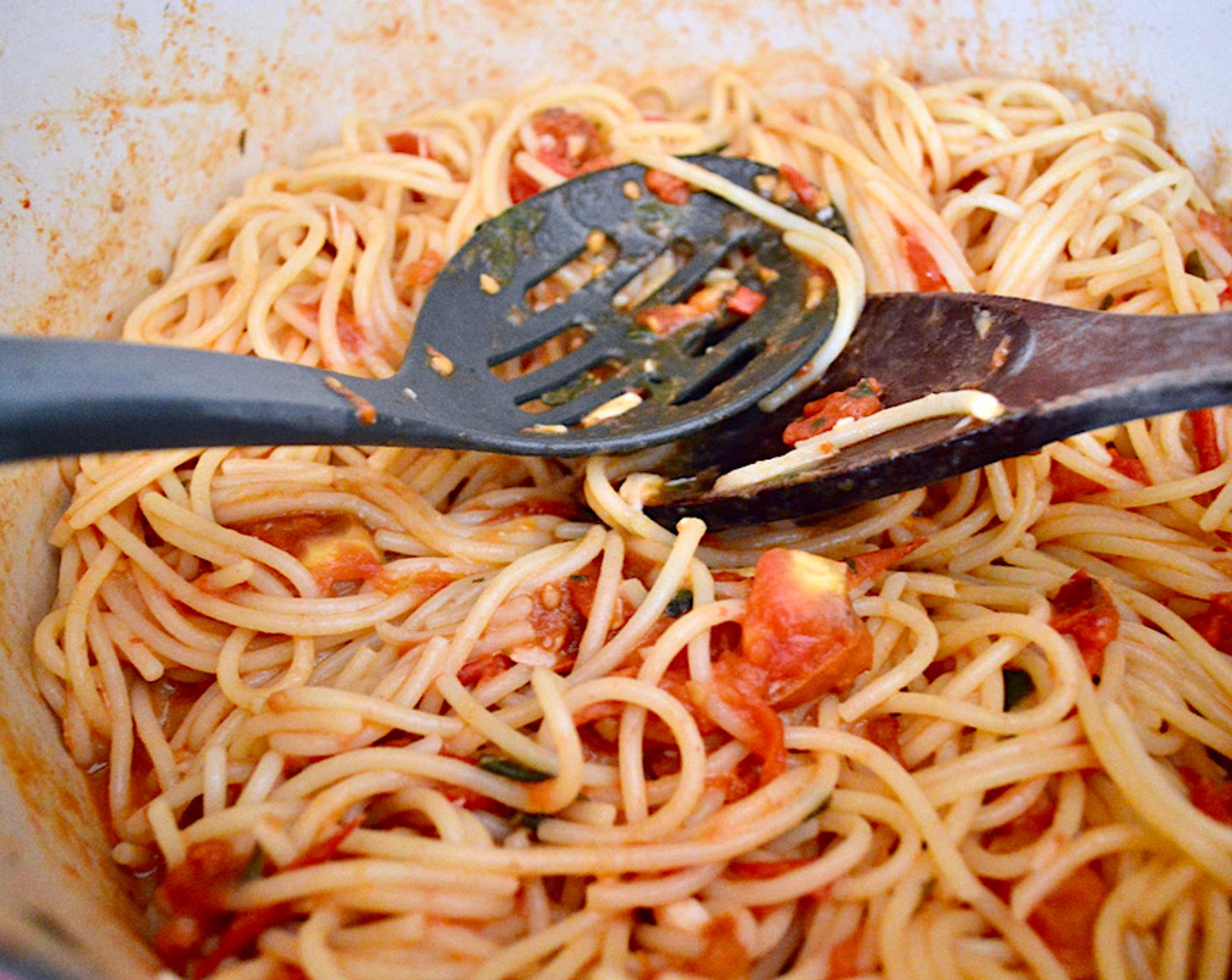 step 6 Finally, toss the drained spaghetti into the sauce and stir until everything comes together.