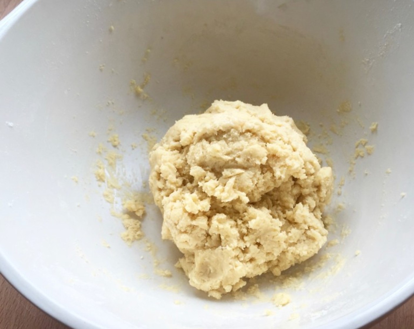 step 11 Using your fingertips or the tips of a fork, gently gather all the butter crumbs into one large dough ball. Be sure NOT to knead the dough as that the dough remains crumbly.