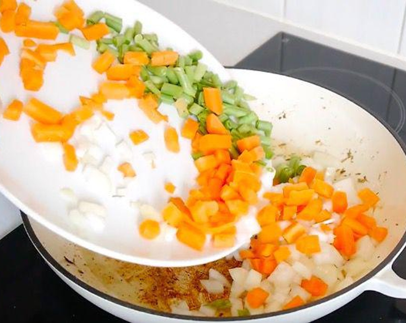 step 3 Then in the same pan, add the Green Bell Pepper (1/2), Red Chili Pepper (1/2), White Onion (1), Garlic (4 cloves), and Frozen Mixed Vegetables (2 1/2 cups). Stir fry until cooked.