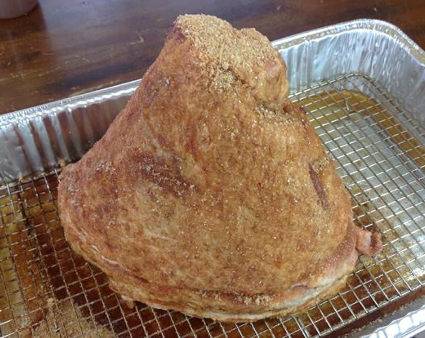 step 5 Once the outside of the ham is covered with the sugar mixture, it’s ready for the smoker. To cook the ham the smoker needs to be between 275-300 degrees F (140-150 degrees C).