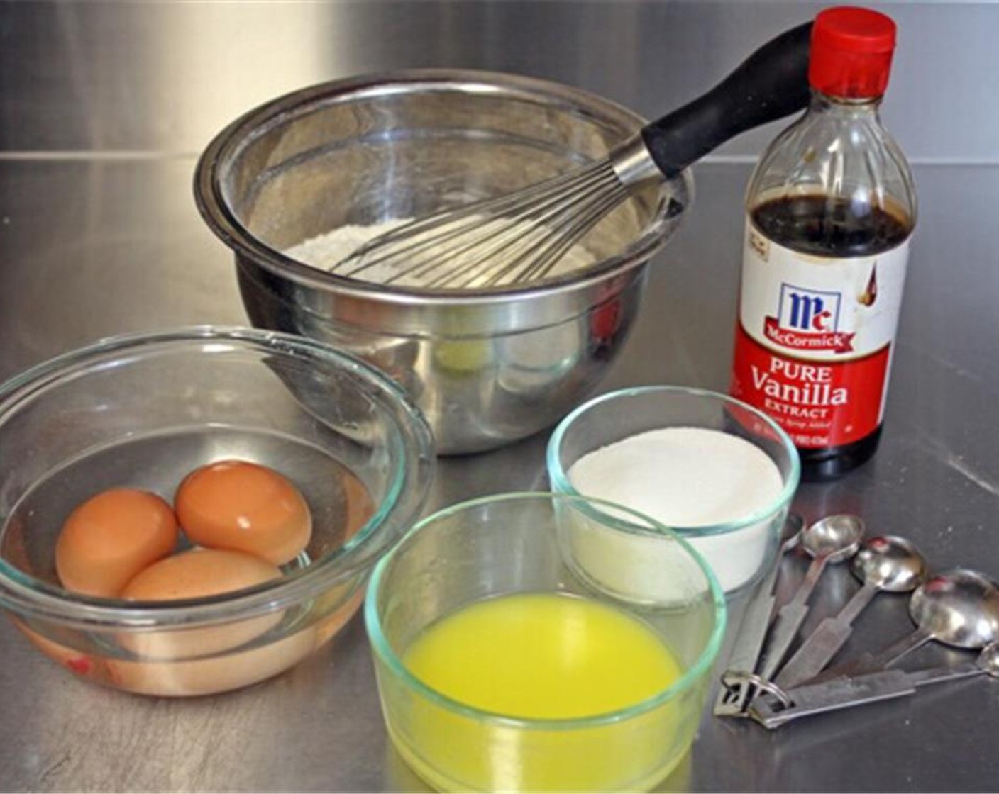 step 4 To make the cookie batter first preheat your pizzelle iron. Sift the All-Purpose Flour (2 cups), Baking Powder (1 Tbsp) and Ground Cinnamon (1/2 Tbsp) into a mixing bowl. Add the Salt (1/8 tsp) and whisk well to combine, set aside.