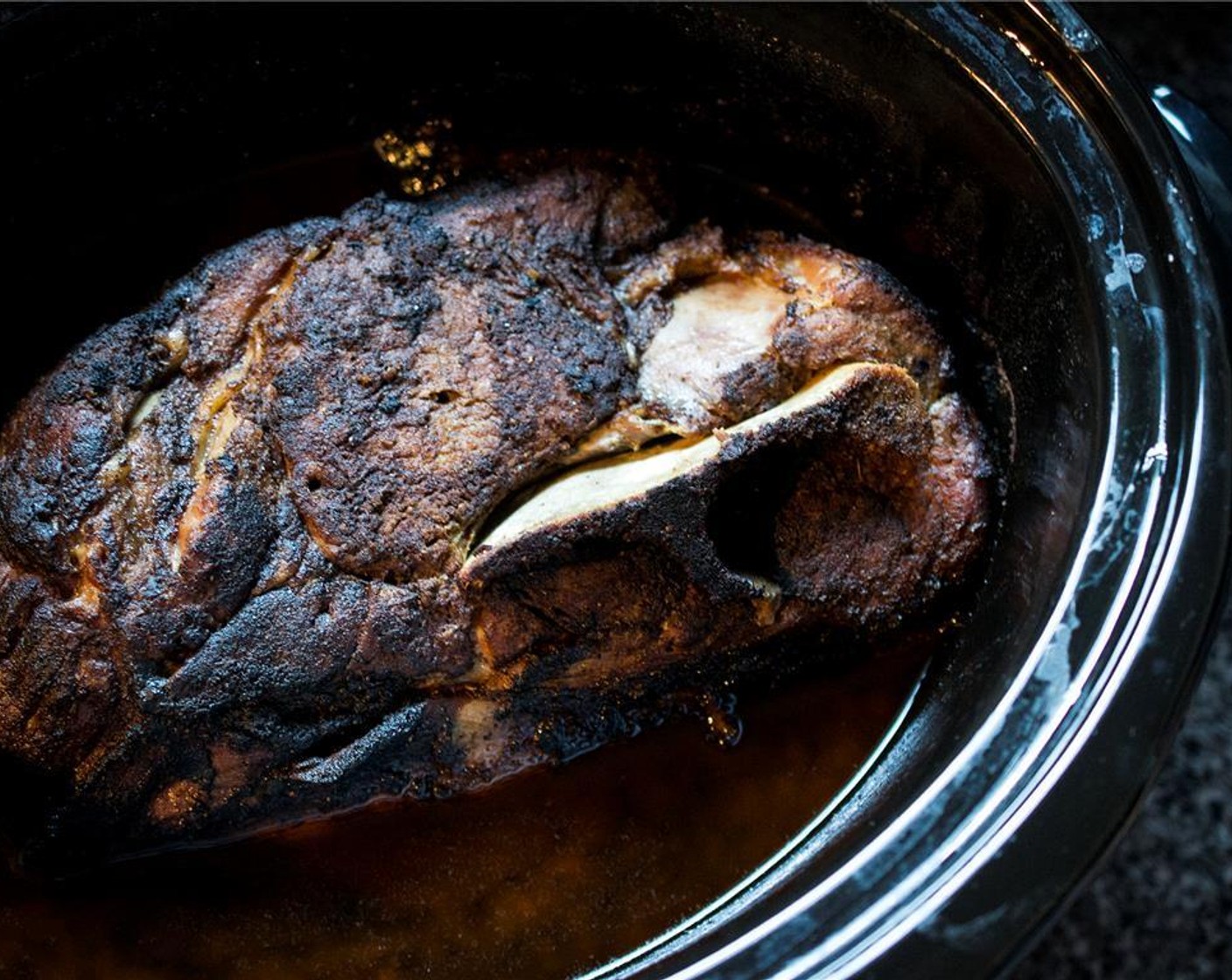 step 7 Place the reserved brine in the bottom of a 5 – 6 quart slow cooker and add pork shoulder. Cover and cook on low for 10 hours. Do not open the lid until done.