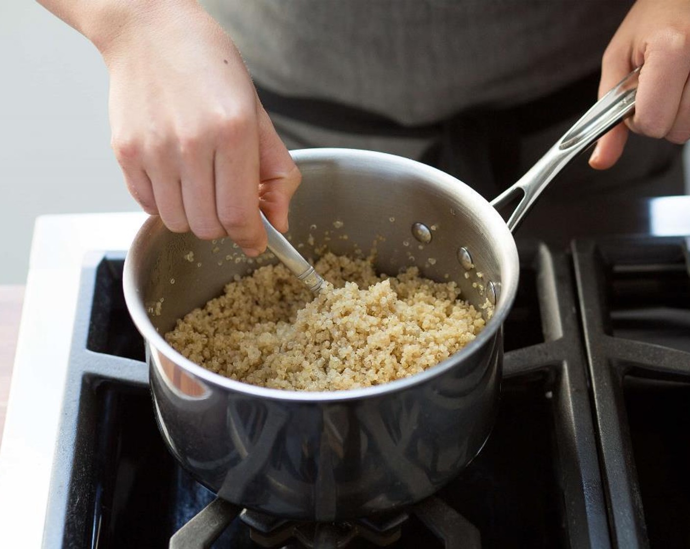 step 2 Add Water (1 1/2 cups) and bring to a boil. Add Quinoa (2/3 cup), return to a boil. Reduce heat to low and cover and let simmer for 20 minutes. Remove from heat, fluff with a fork and keep warm until plating.