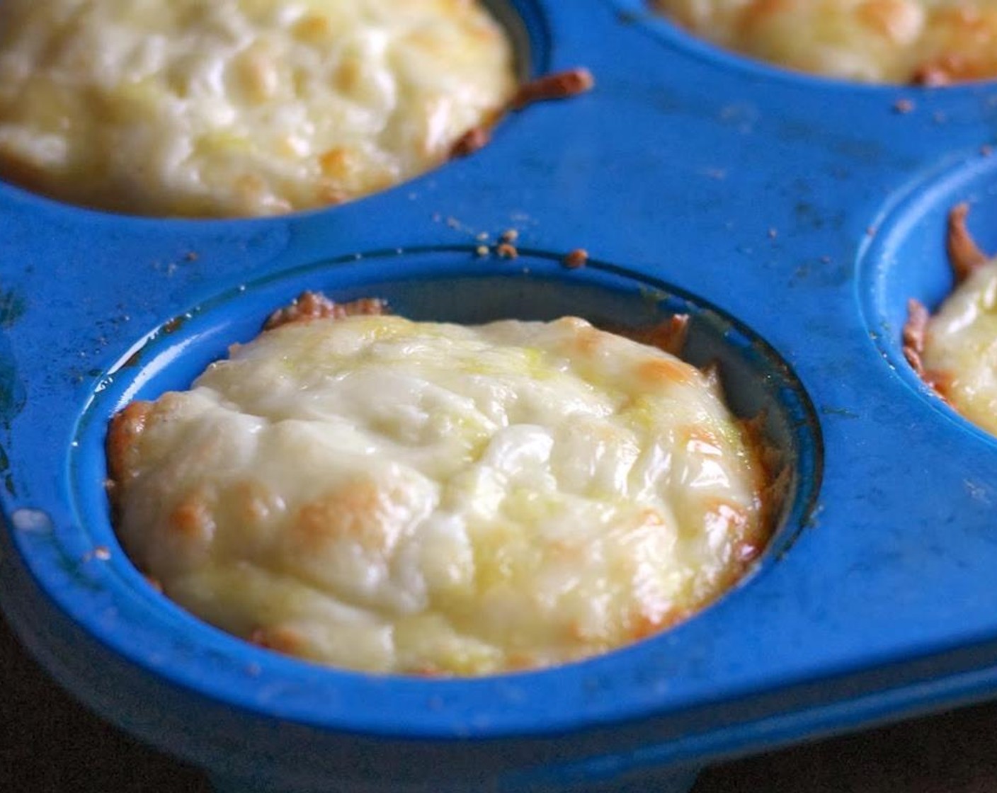 step 7 Bake at 350 degrees F (175 degrees C) for approximately 30 minutes; or until muffins are puffy and lightly brown. During this time you can heat the marinara sauce (to taste).