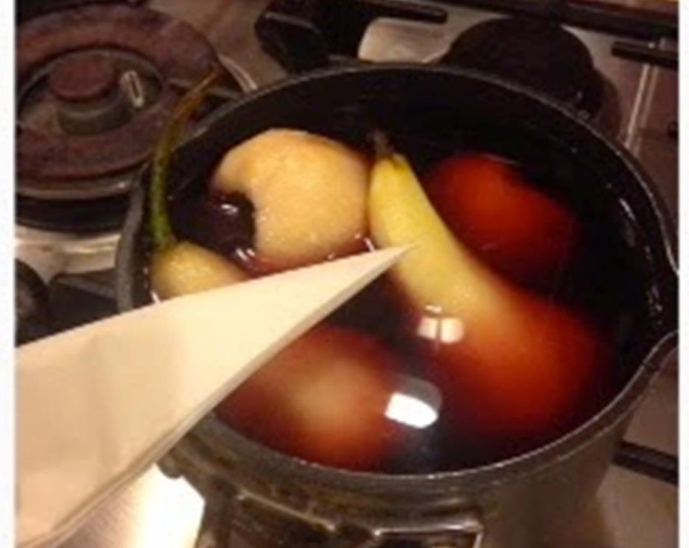 step 1 Combine Dry Red Wine (1 cup), Water (1 cup), Granulated Sugar (3 Tbsp), and Ground Allspice (1 tsp) together in a pot. Peel the Pears (4) but keep the stalk intact. Put the pears into the red wine and put on stove and heat to a boil.