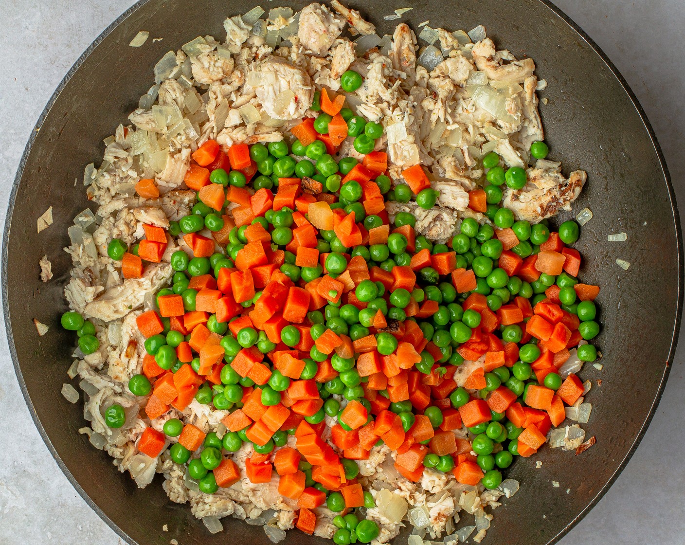 step 2 Fold in the Rotisserie Chicken (1 lb), Frozen Peas and Carrots (1 1/2 cups) for 2 minutes. Vegetables should be defrosted before proceeding.