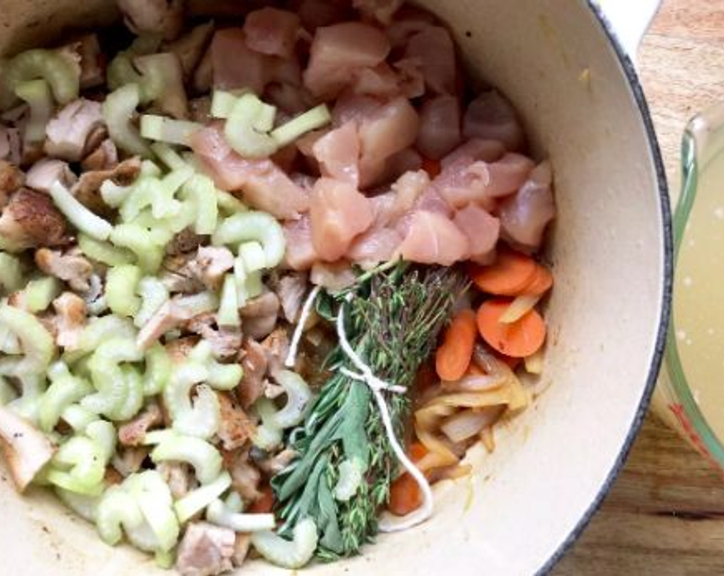 step 4 Add the herbs, Chicken Stock (6 cups), Sliced Celery (1 cup) and Chopped Boneless, Skinless Chicken Breast (1) to the pot. Bring to a boil, then reduce heat and cook for 10 minutes.