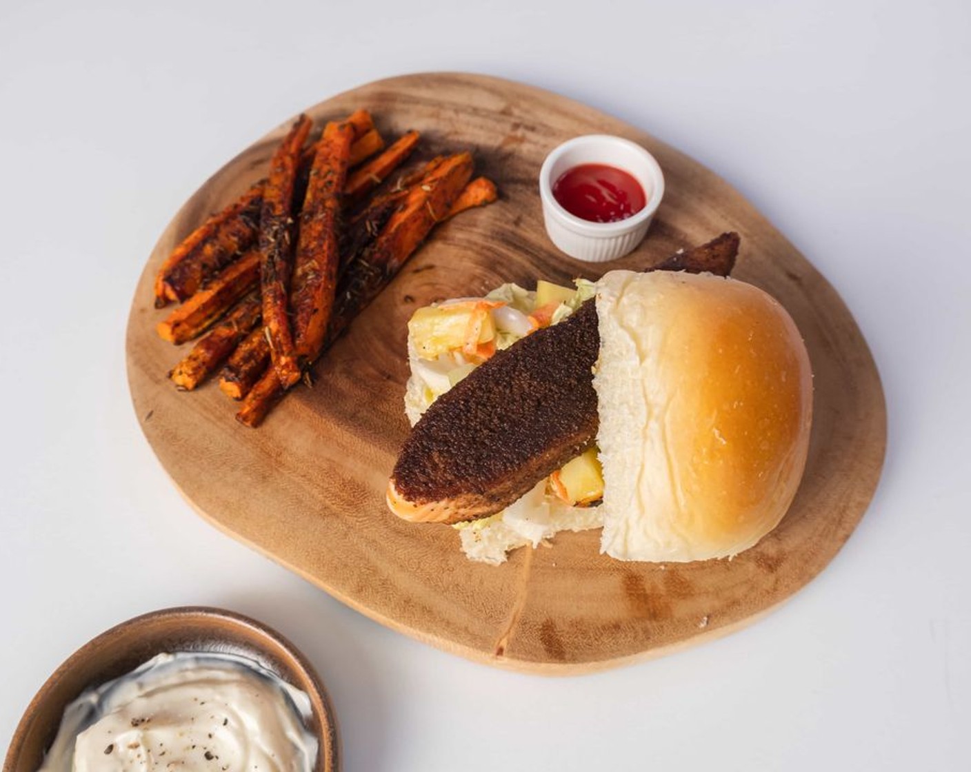 Jerk Salmon Sandwich with Charred Pineapple Slaw and Carrot Fries