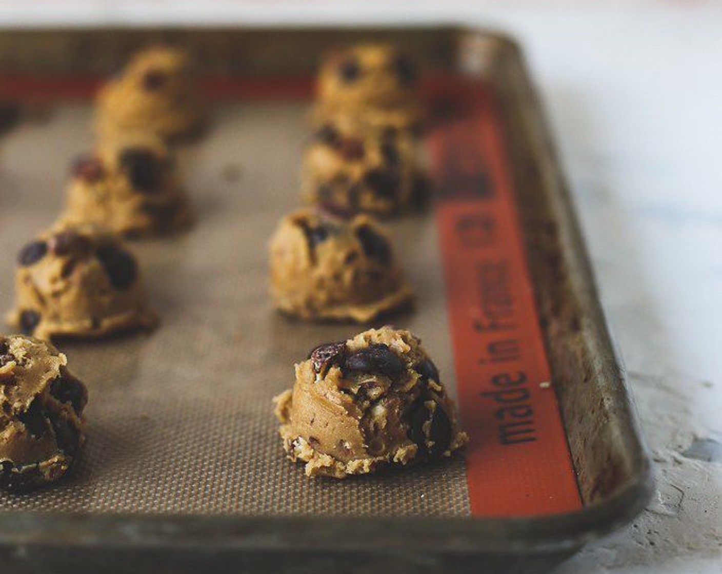 step 7 Scoop dough with a small cookie scoop and place 2 inches apart on baking sheets lined with a Silpat mat or parchment paper.