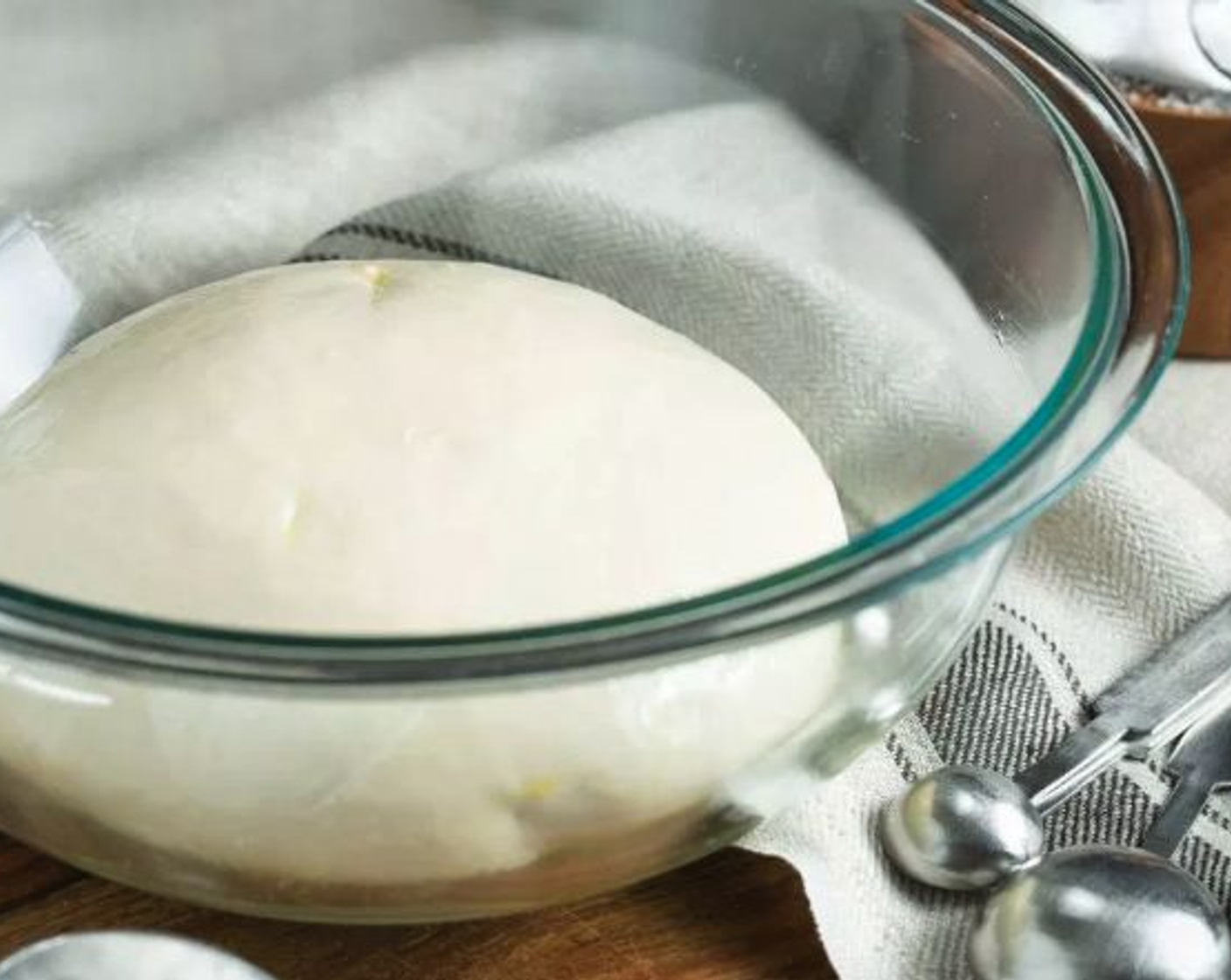 step 6 Place dough in a large bowl lightly coated with Neutral Oil (1 tsp). Cover with plastic wrap or clean kitchen towel and allow to rise in a warm, draft-free area for 1 hour, until doubled in size.