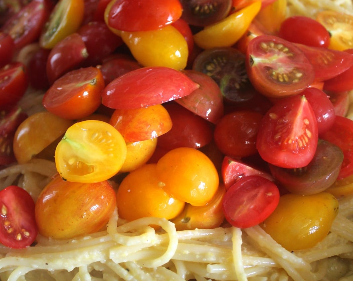 step 10 When the pasta is finished cooking, use tongs to transfer it to the sauté pan and toss it with the sauce. Add the Cherry Tomatoes (4 cups) and reserved corn and toss again.