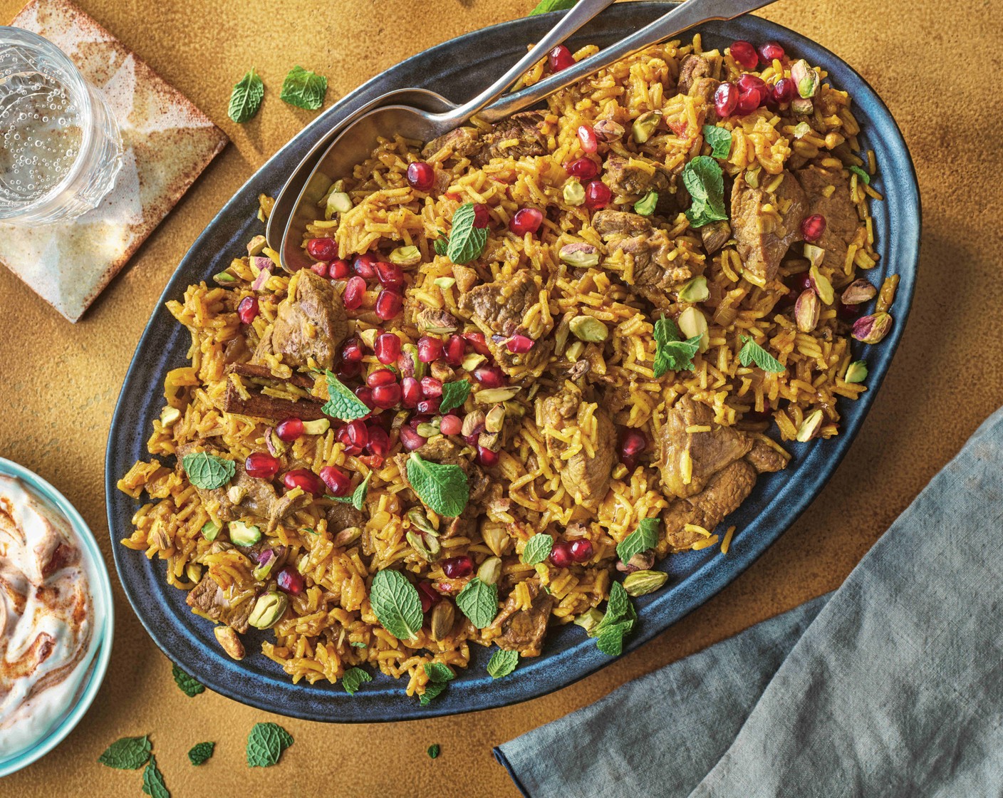Jewelled lamb pilaf with spiced yogurt M&S