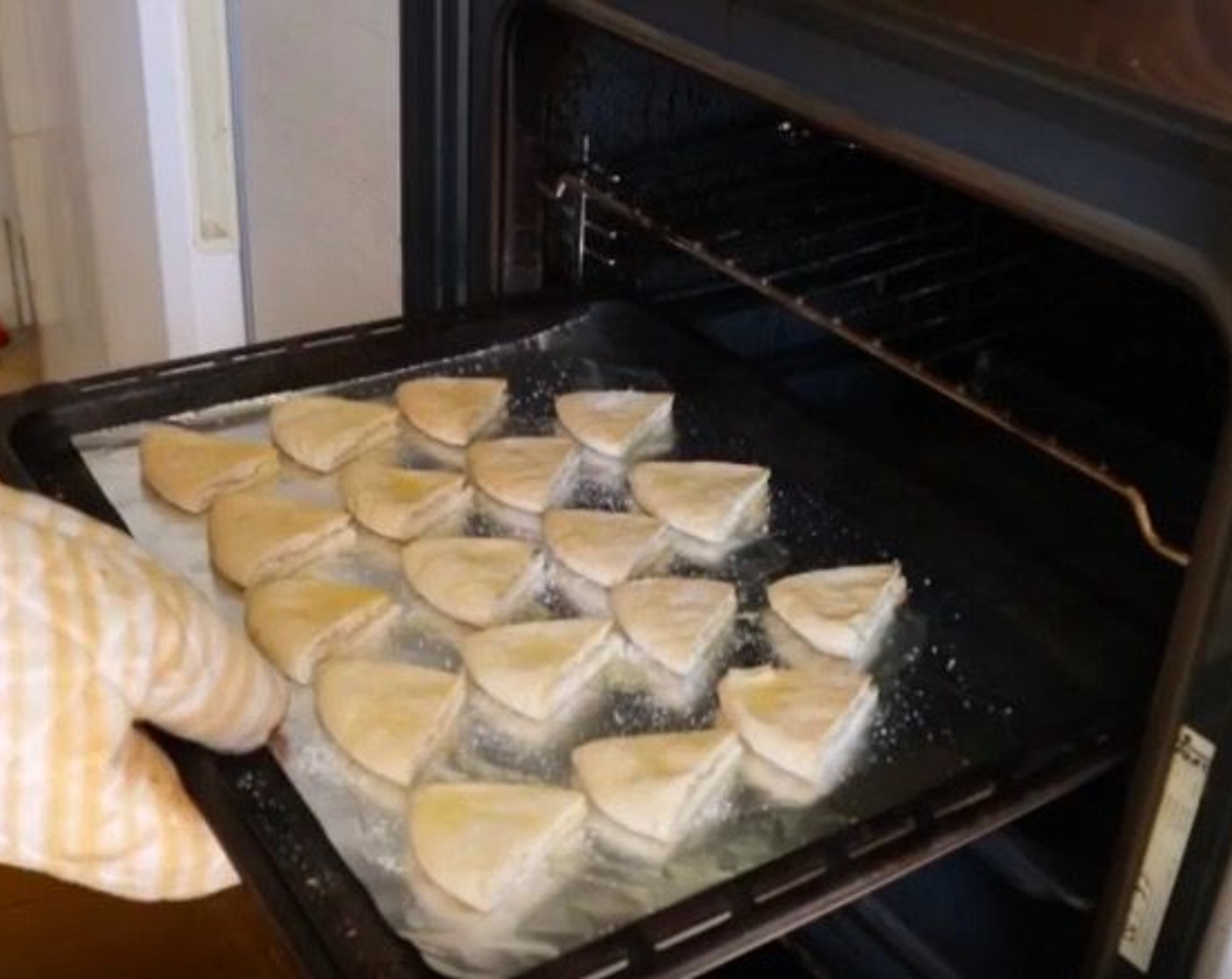 step 2 Cut each of the Pita Bread (3 pieces) into 6 evenly-sized triangles. Add them to a baking tray lined with foil paper and drizzle with Extra Virgin Spanish Olive Oil (to taste). Season with Sea Salt (to taste).