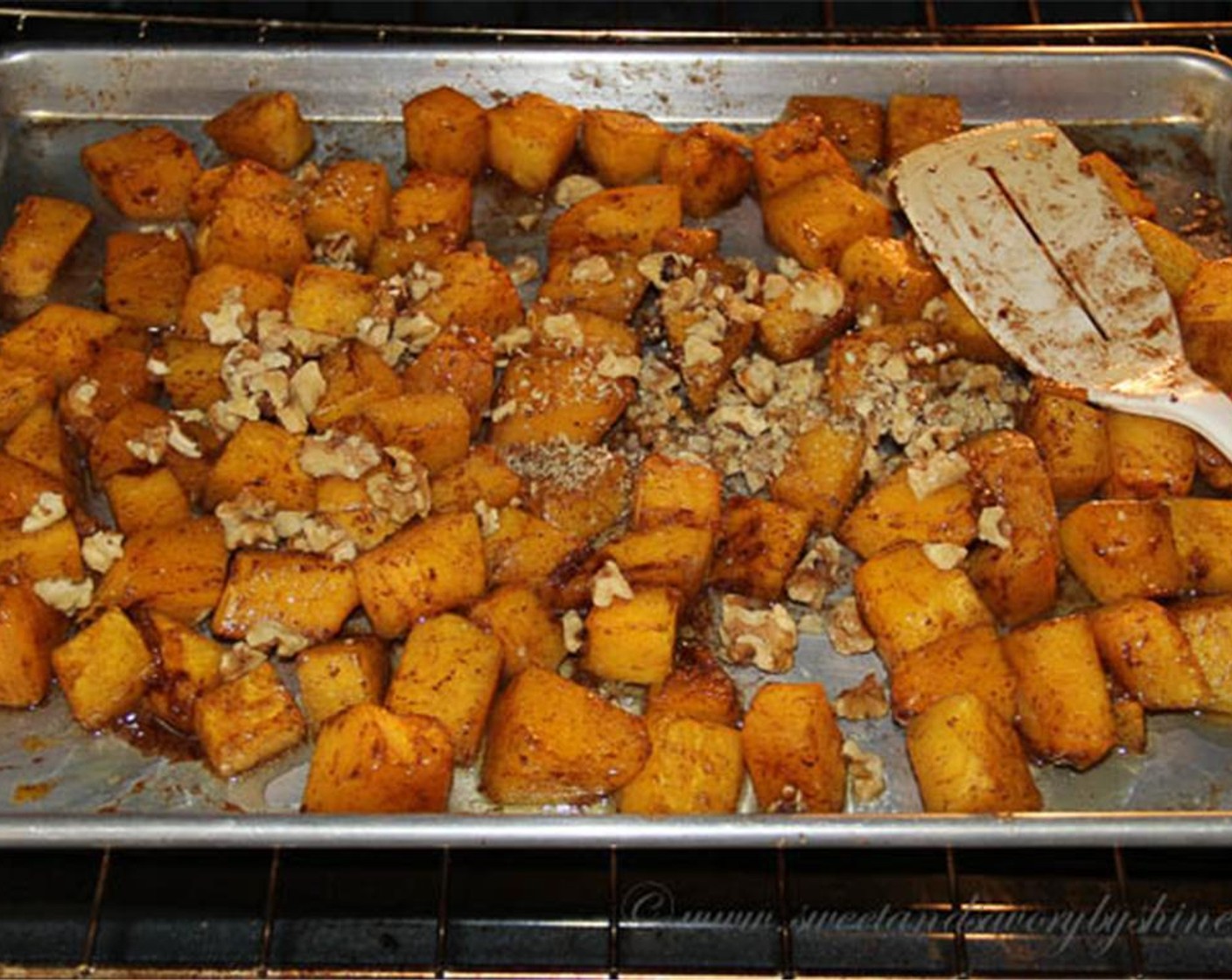 step 8 Add walnuts to the baking tray and roast for 10 more minutes.