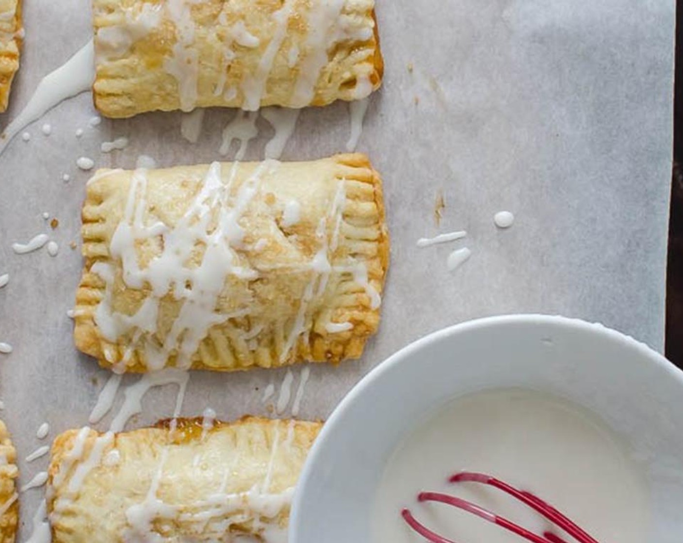 step 12 While pies cool, mix Powdered Confectioners Sugar (1 cup) and add Cream (2 Tbsp) in a small bowl until smooth. Drizzle the pies with the glaze and let dry about 15 minutes.