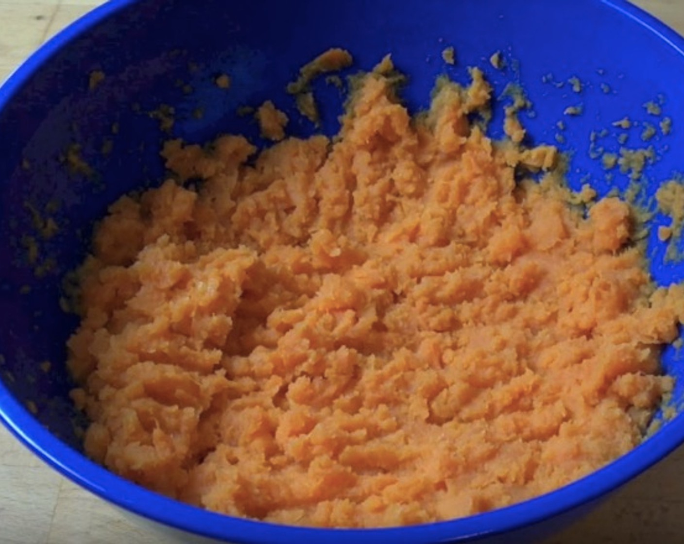 step 9 In a mixing bowl, add Sweet Potatoes (2.2 lb) and 1 tablespoon of chopped butter. Mash until there are no big lumps. Let cool.