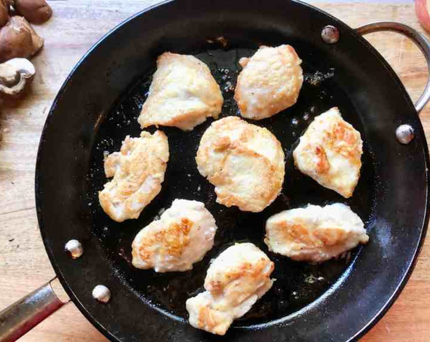 step 7 Heat a large skillet over medium heat, add Olive Oil (2 Tbsp). When the oil shimmers, add the prepared chicken to the skillet and fry for about 5 minutes per side or until golden. Remove the chicken from the skillet and set it aside.