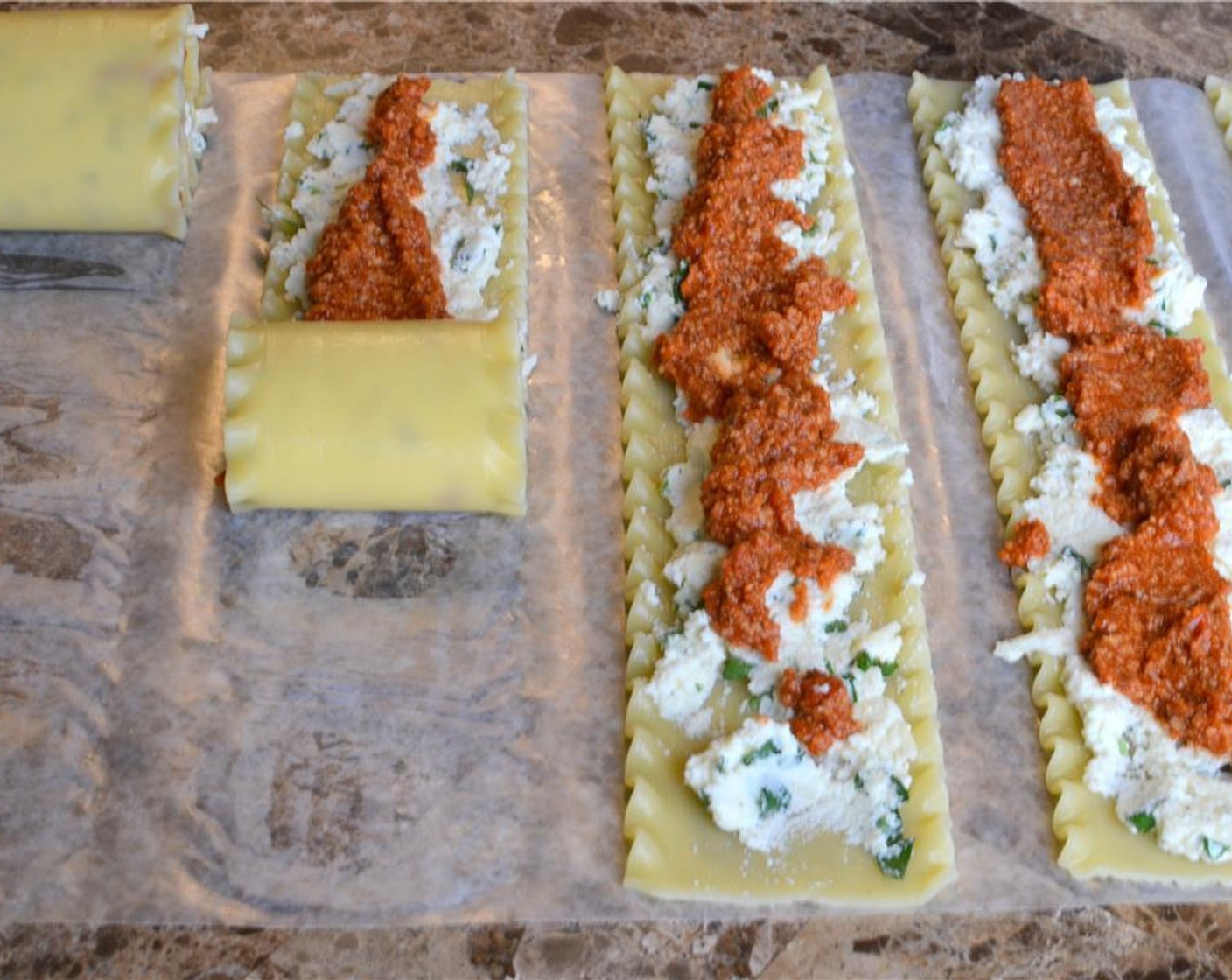 step 11 Roll up each of the lasagna sheets individually.