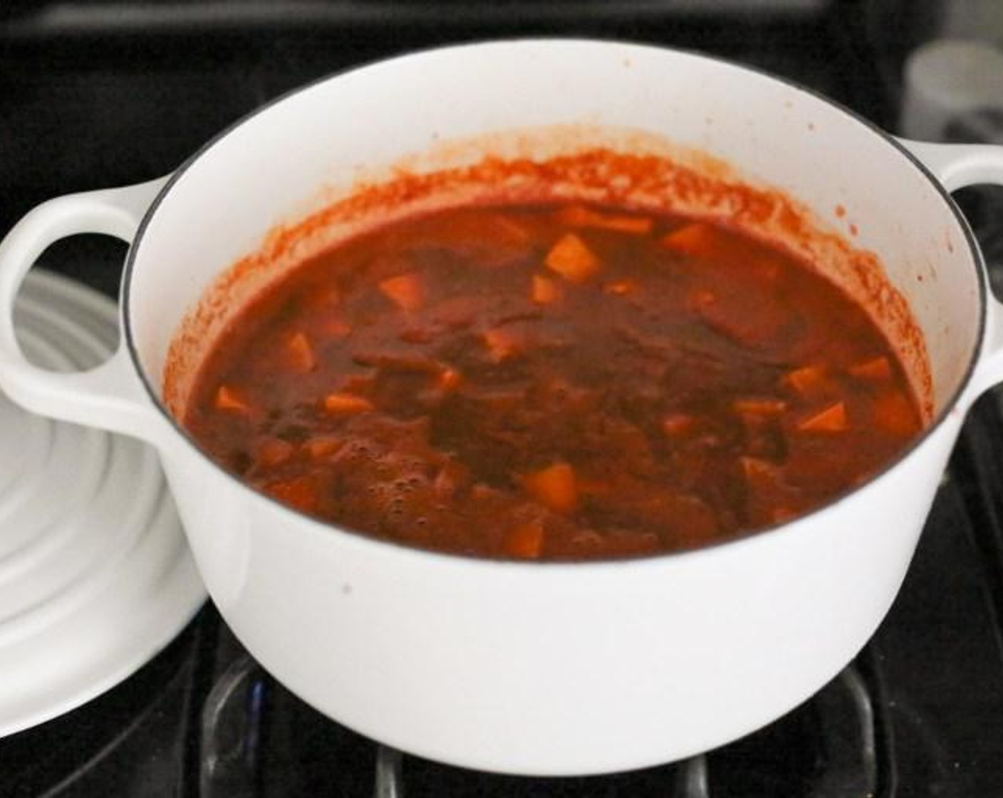 step 2 Add the Smoked Paprika (1 tsp) and Ground Cumin (3/4 tsp) and cook for 1 minute to get the spices nice and toasty. Add the Chipotle Peppers in Adobo Sauce (1), Adobo Sauce (1 Tbsp), Sweet Potato (1), Canned Black Beans (2 1/3 cups), Canned Tomato Purée (1 2/3 cups) and Low-Sodium Vegetable Stock (3 cups) to the pot.