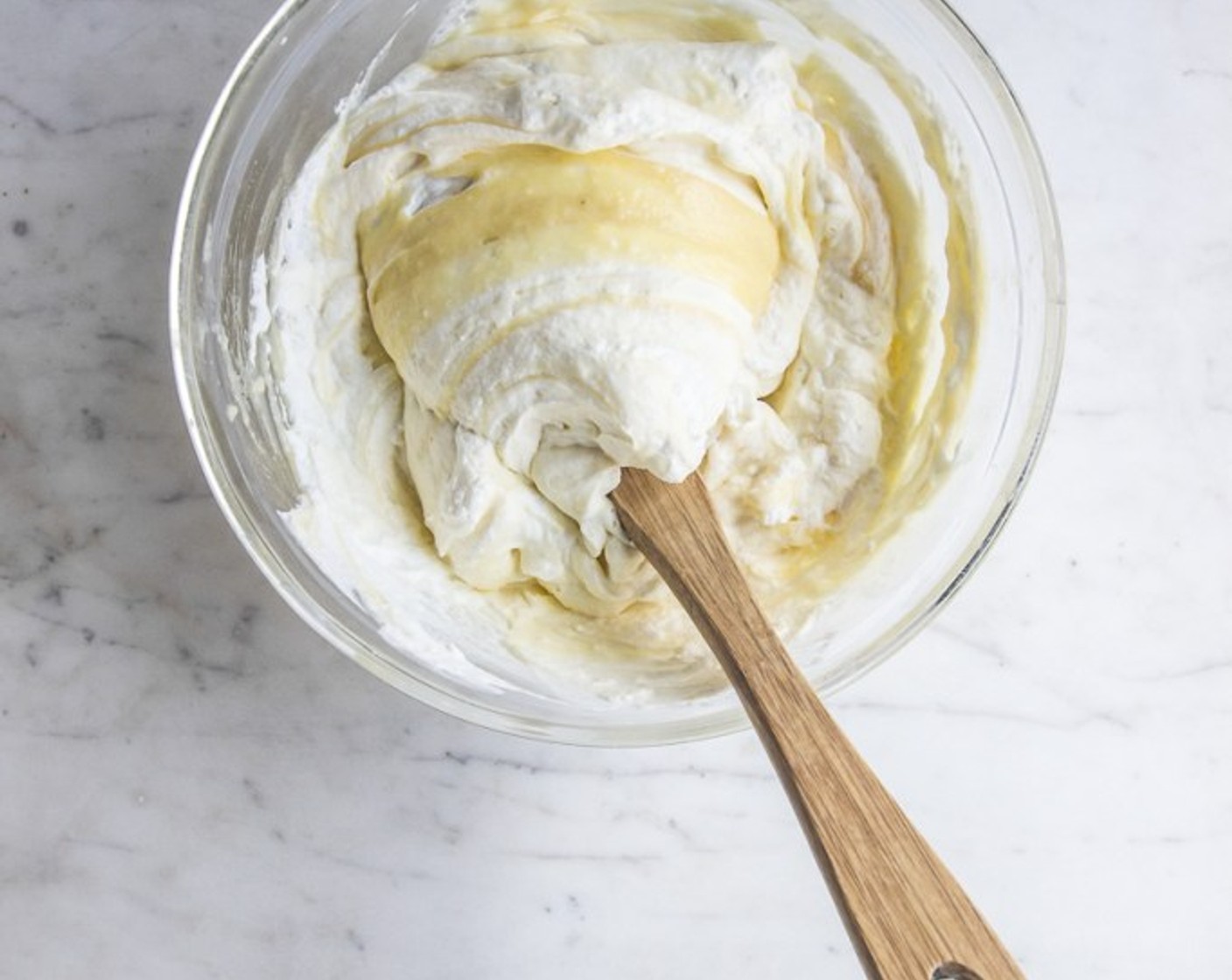 step 11 To assemble the cake, whip Heavy Cream (1 cup) until medium soft peaks and fold whipped cream into the chilled lemon curd.