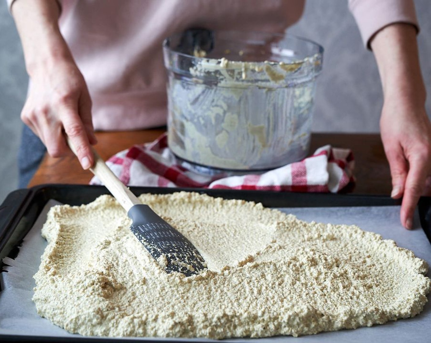 step 4 Pour the batter onto the baking sheet, using a spatula to spread evenly across the sheet.