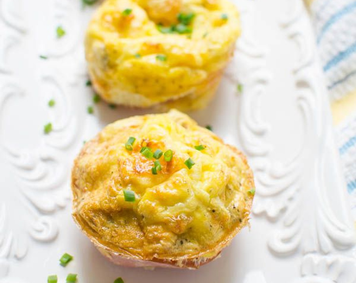 step 10 Remove from the oven and let rest for 1-2 minutes. Use a sharp knife to loosen the edges of the egg cups and transfer to a platter or plate. Sprinkle with Fresh Parsley (to taste).