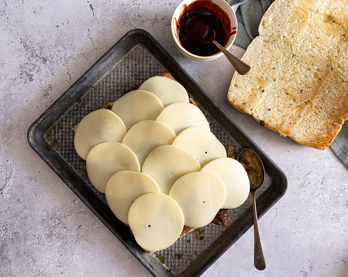 step 8 Arrange Provolone Cheese (12 slices) on top of the beef.