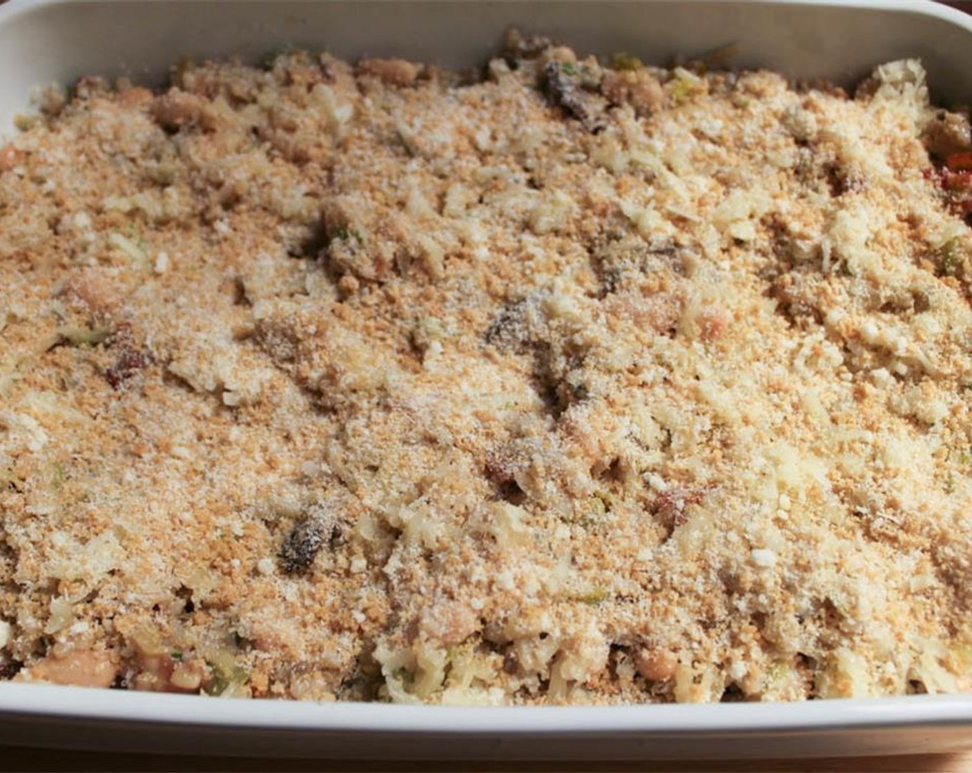step 16 In a small bowl, combine the Whole Wheat Panko Breadcrumbs (1/4 cup) and Parmesan Cheese. Sprinkle the mixture in an even layer over the casserole.