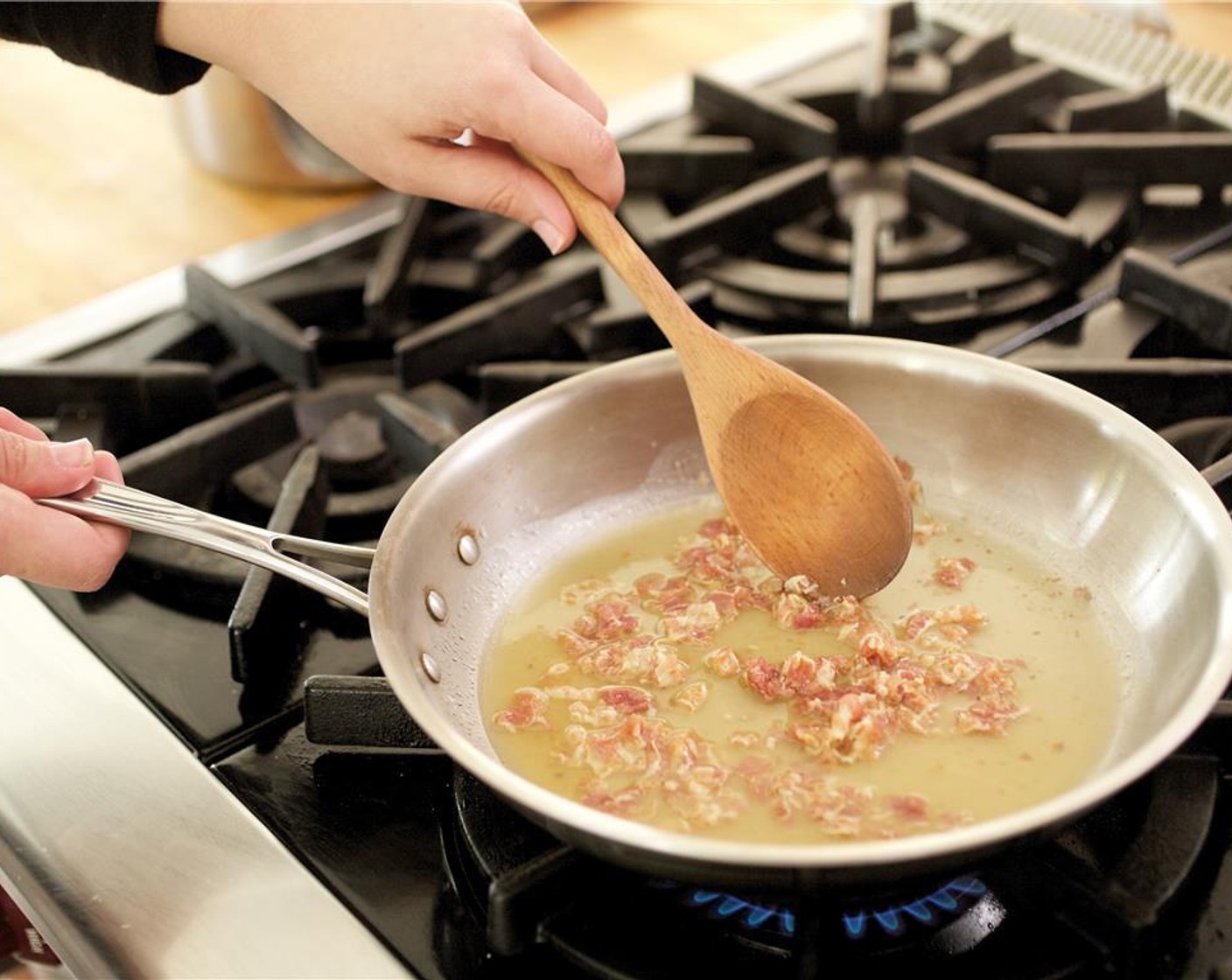 step 9 Add the chicken broth and continue to reduce for eight minutes.