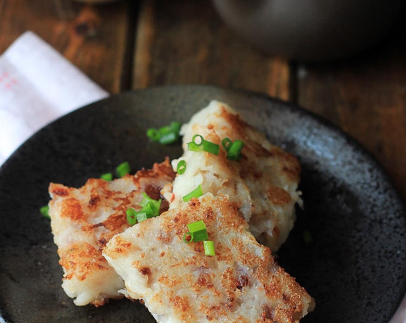 step 8 Cut into slices around 1.5 cm in thickness after cooling down. Pan-fry until slightly brown on both sides. Sprinkle some Scallion (1 bunch) and serve with your favorite tea.