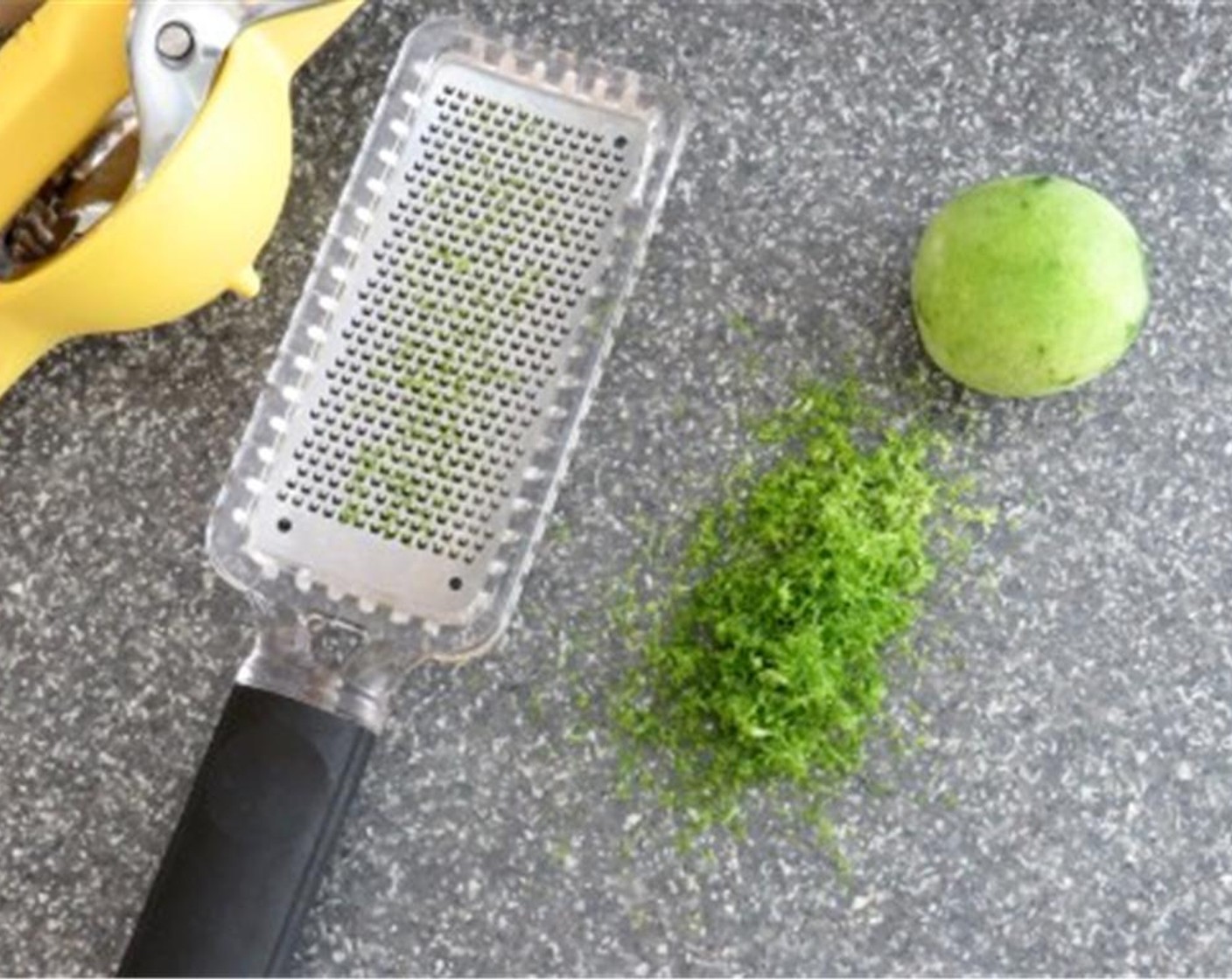 step 2 Husk, rinse, and quarter the Tomatillo (1 lb)). Zest and juice the Lime (1), reserving for use later.