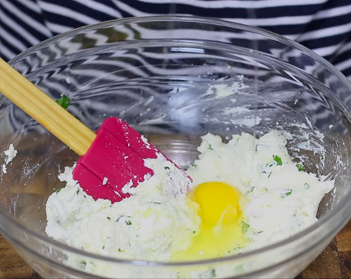 step 3 In a large bowl, combine Ricotta Cheese (1 3/4 cups), Parmesan Cheese (1/2 cup), Fresh Parsley (1 Tbsp), Shredded Mozzarella Cheese (1/2 cup), Salt (to taste), Ground Black Pepper (to taste), and Egg (1). Mix until well blended.