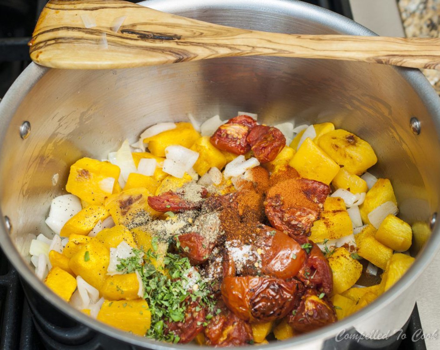 step 8 To the pot add roasted vegetables, Chicken Broth (4 cups), Fresh Oregano (1 Tbsp), Smoked Paprika (1/2 tsp), Dry Mustard (1/2 tsp), Dried Sage (1/4 tsp), Salt (1/2 tsp), Ground Black Pepper (1/2 tsp), Chili Powder (1/4 tsp), and Crushed Red Pepper Flakes (1 pinch). Cover and simmer for a minimum 30 minutes.