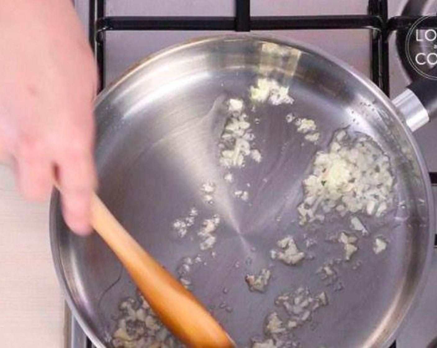 step 5 Heat Vegetable Oil (1 Tbsp) in a deep bottomed skillet and add Garlic (5 cloves).