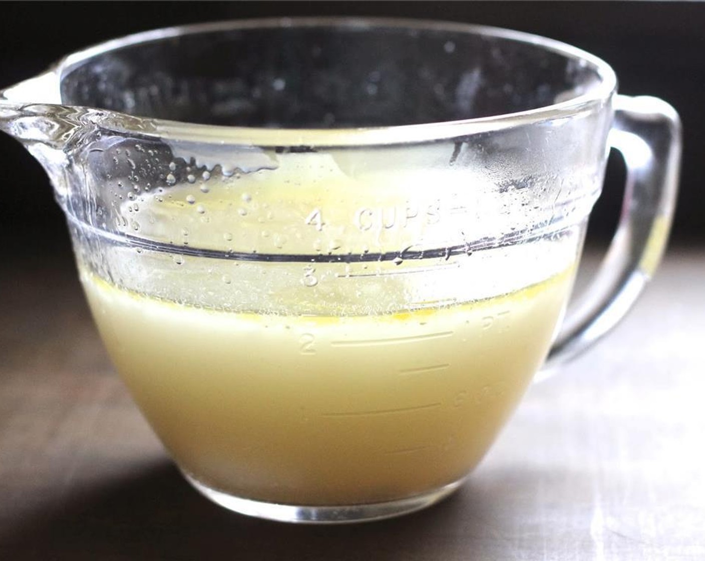 step 4 Meanwhile, strain the chicken broth into a clean stock pot. Reserve some of the broth for the sauce.