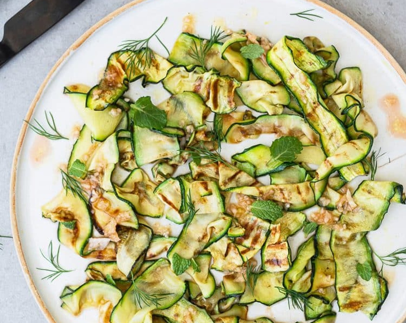 step 6 Lightly drizzle the dressing over the courgette “ribbons” and serve.