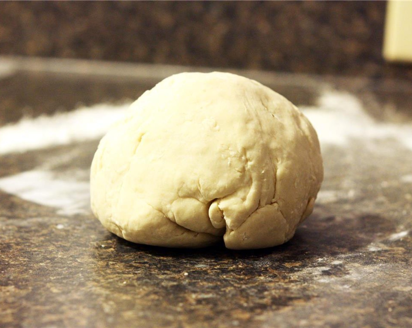 step 4 Once dough has rested, remove it from the bowl and knead for 5-10 minutes until dough is fairly smooth.