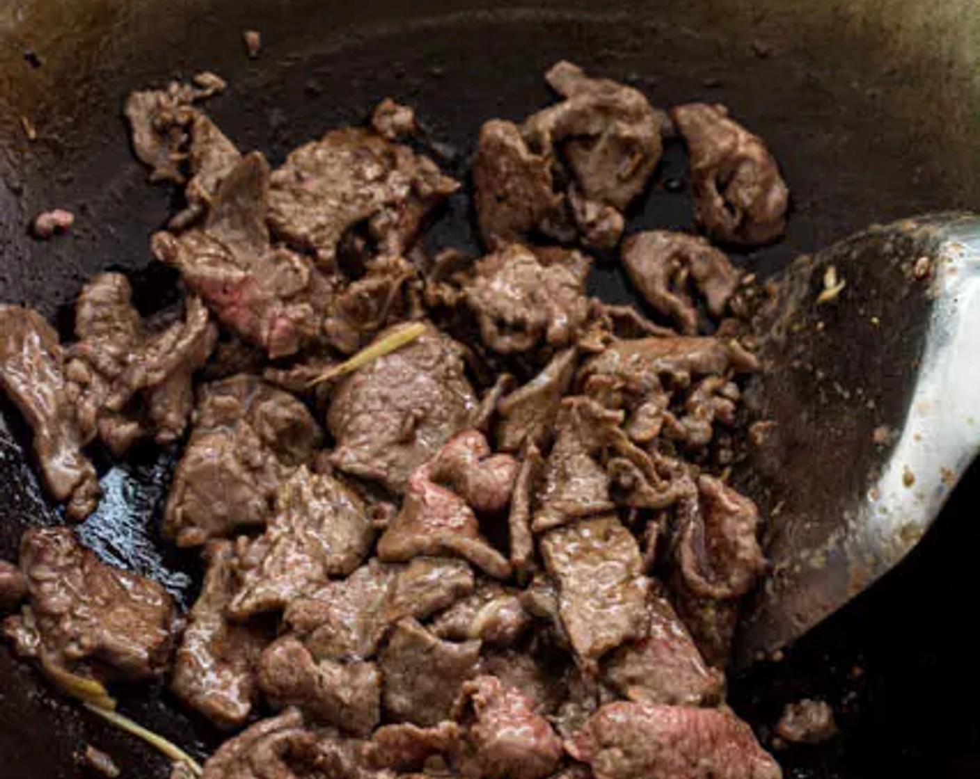 step 6 Wait for a few seconds before flipping them over. Remove the beef from the wok as it starts to turn brown and finish off the remaining batches.