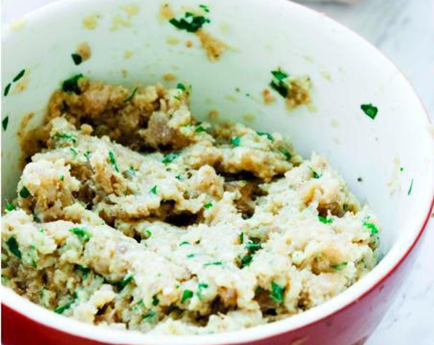 step 2 In a bowl combine Tuna Fillets (1.1 lb), Egg (1), Fresh Parsley (2 Tbsp), Dried Oregano (1 tsp), Garlic (2 cloves), Bran Flakes (2 Tbsp), Lemon (1/2), Pink Himalayan Sea Salt (1/2 tsp), and Finely Ground Black Pepper (1/4 tsp). Mix everything together.