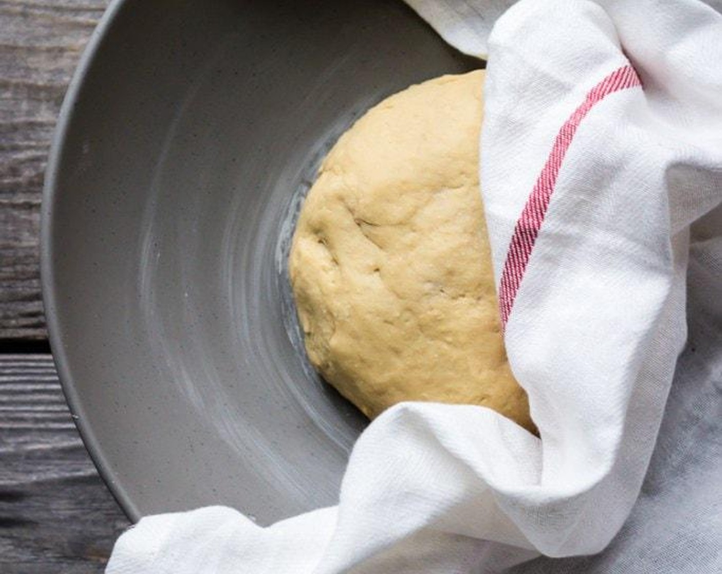 step 6 Transfer the dough to a lightly greased bowl large enough for the dough to rise double its size. Set in a warm, draft free location until doubled, about 1 hour.