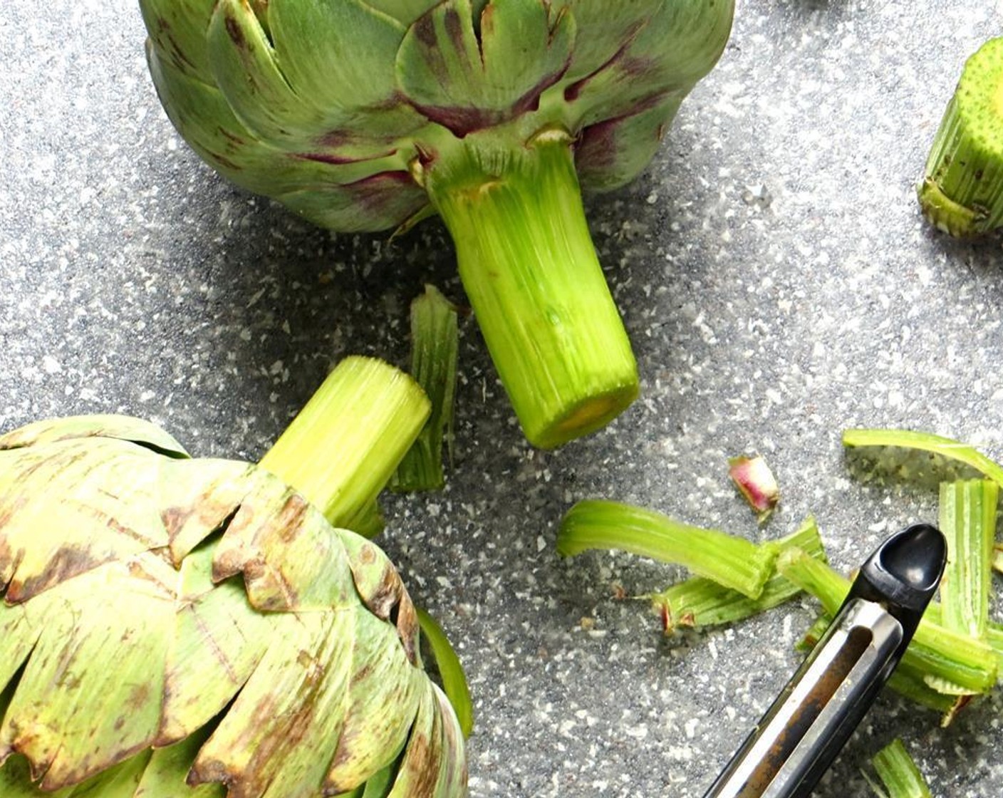 step 2 Meanwhile, prep the Artichokes (2): Remove any small leaves on the stem. Peel the stem using a sharp knife or vegetable peeler. Trim the stem, keeping about an inch or two on the artichoke. Discard the remnants.