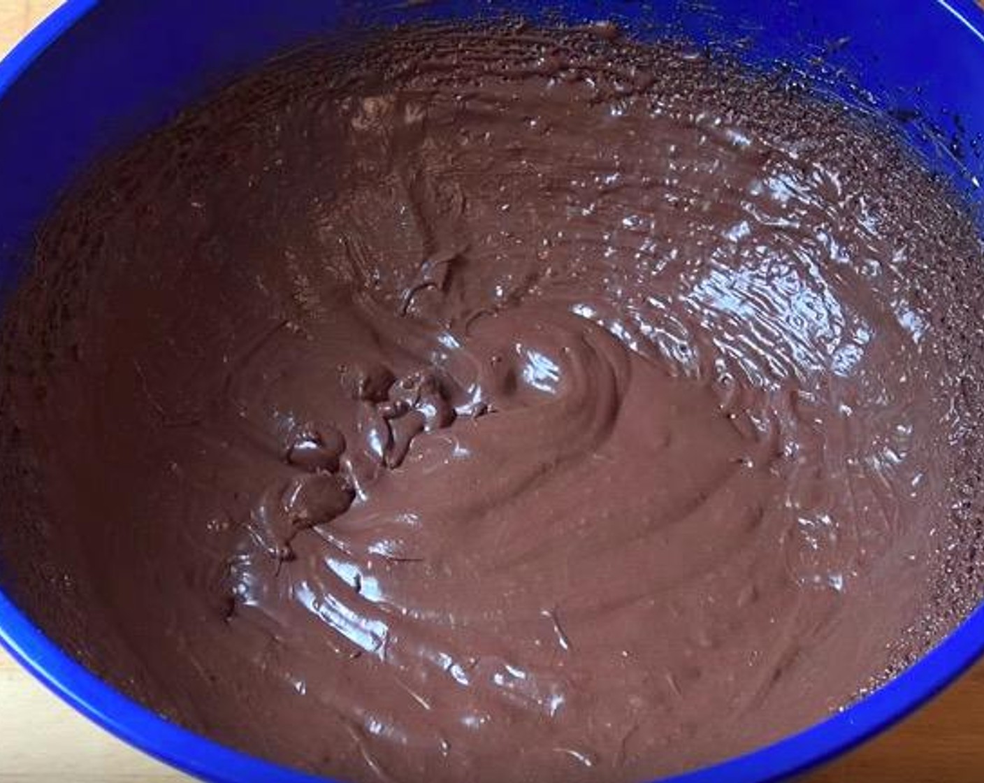 step 6 Into the bowl with the beaten whipping cream, add the chocolate mixture 1/3 at a time, beating with a hand mixer on high throughout.