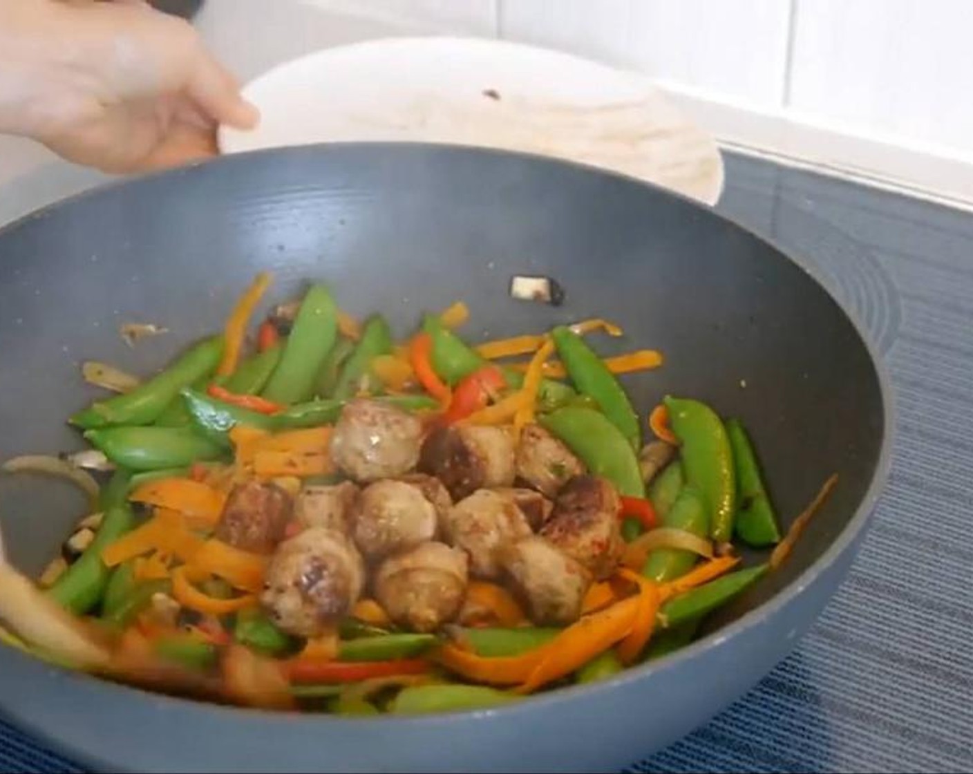 step 5 Once the onion and bell peppers are soft add the sausage back to the pan and stir everything together and leave to cook for another minute and serve hot!!